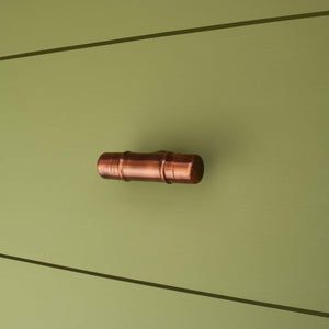 Copper Knob T-shaped - Aged - On Green Drawers