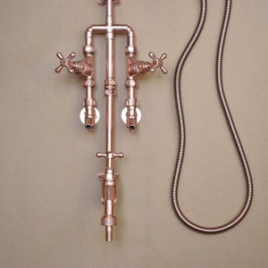 Minimalist copper outdoor shower with a simple design garden tap and hand-shower hose