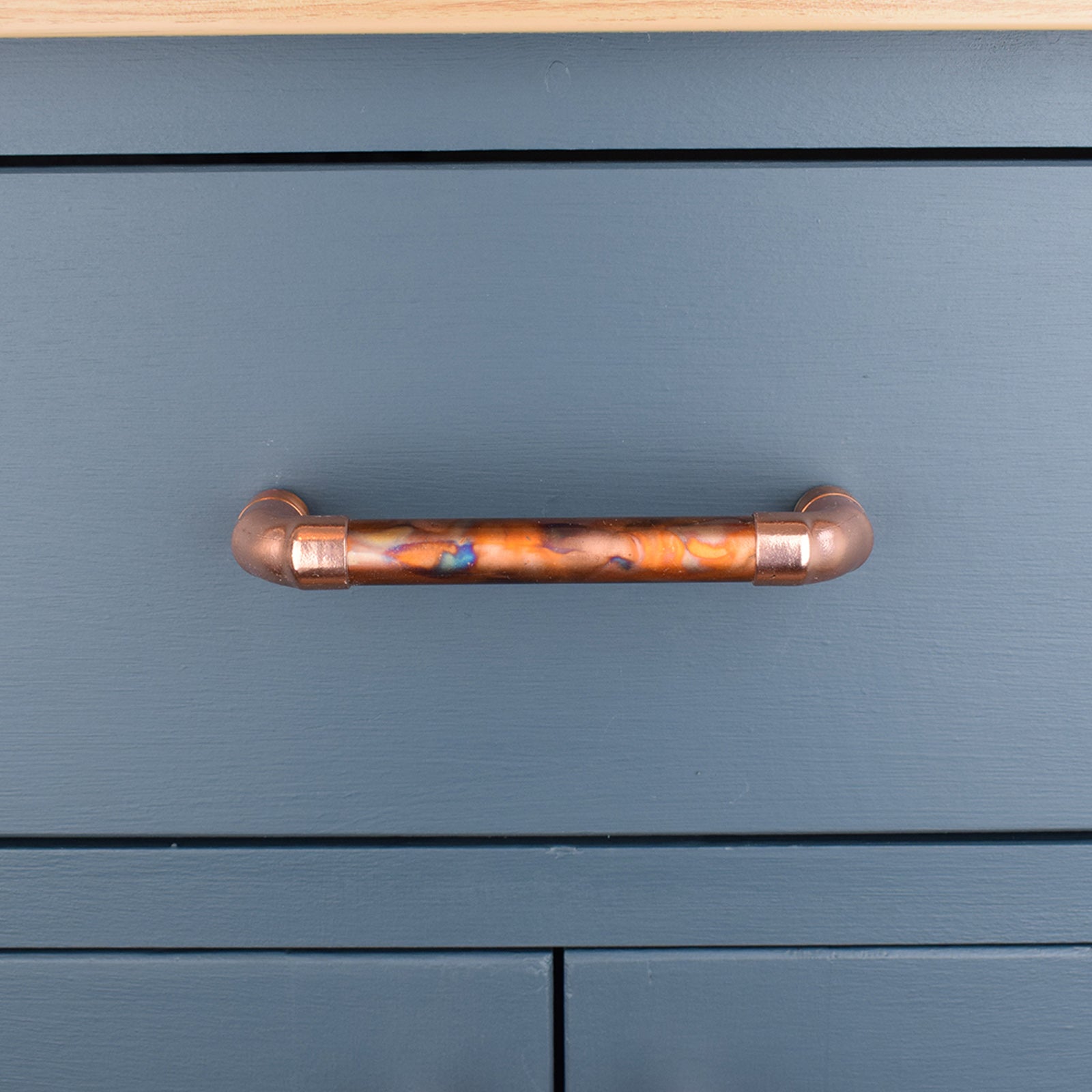 Copper Pull Handle - Marbled / High Polish Mix - On blue kitchen drawers