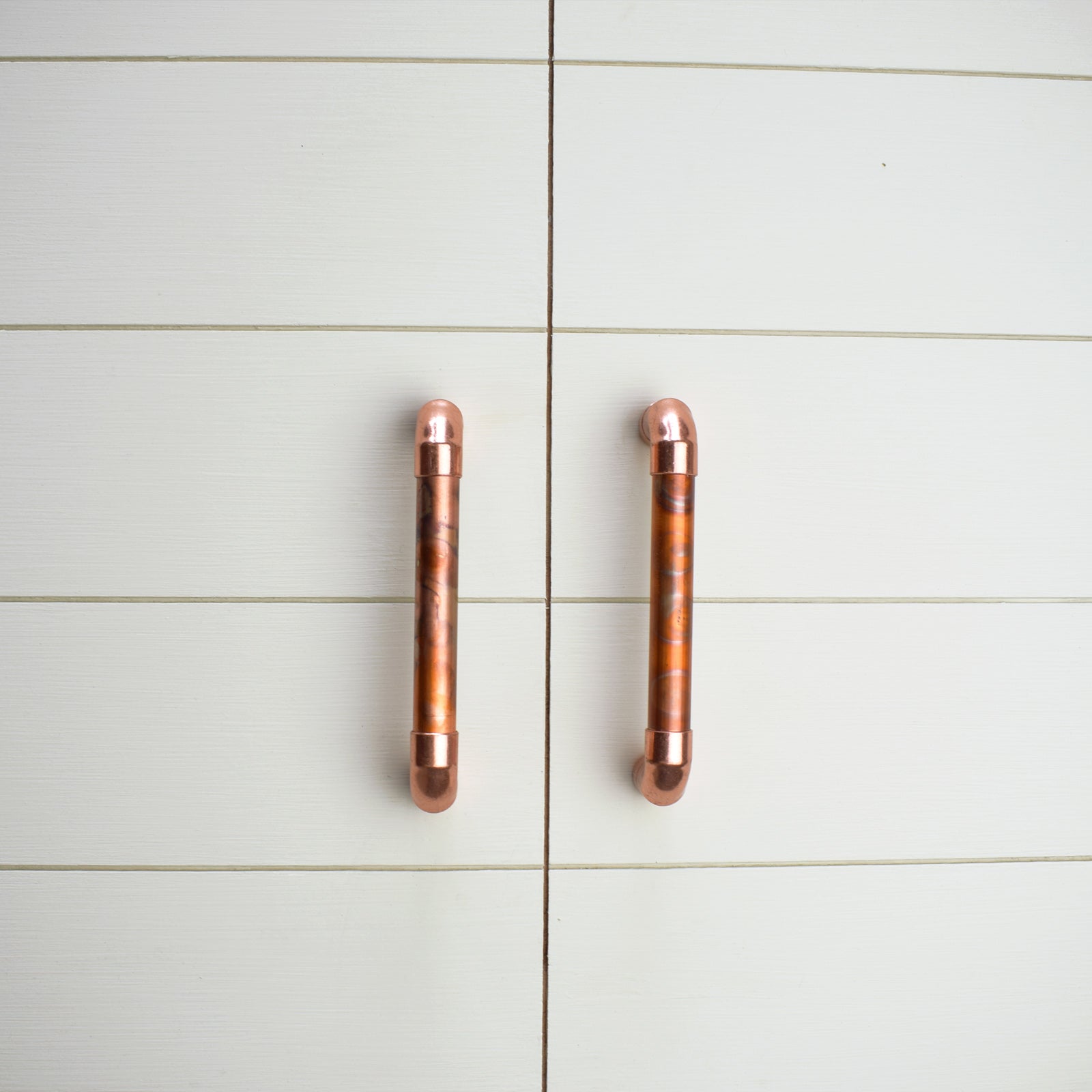 Copper Pull Handle - Marbled / High Polish Mix - On white cabinets