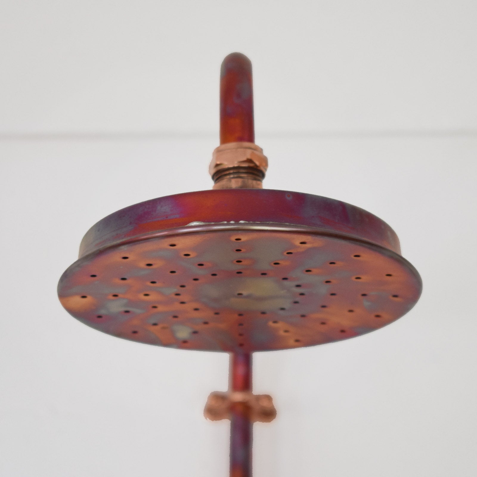 marbled copper shower head close up image