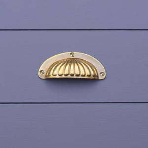 Brass Scalloped Cup Handle on blue kitchen drawers
