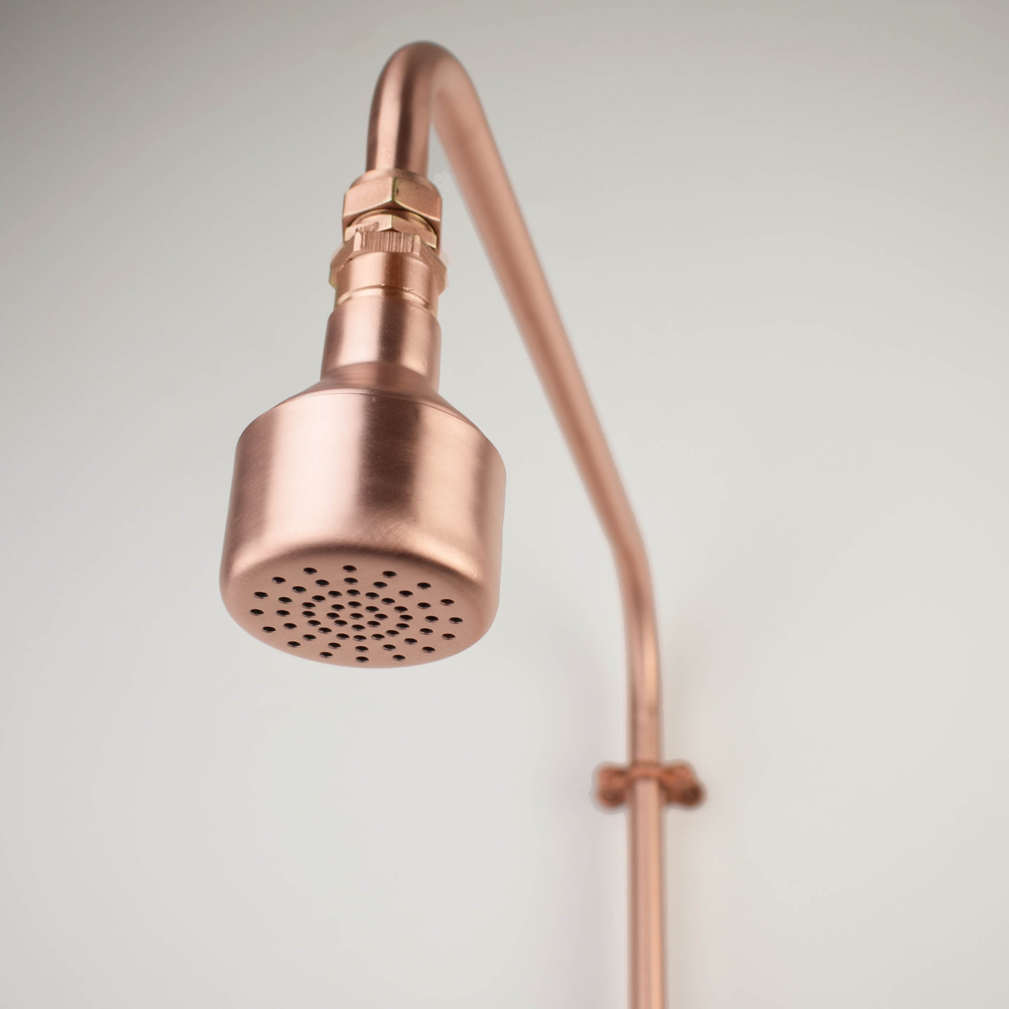 copper shower head for a relaxing out door living space with natural health benefits 