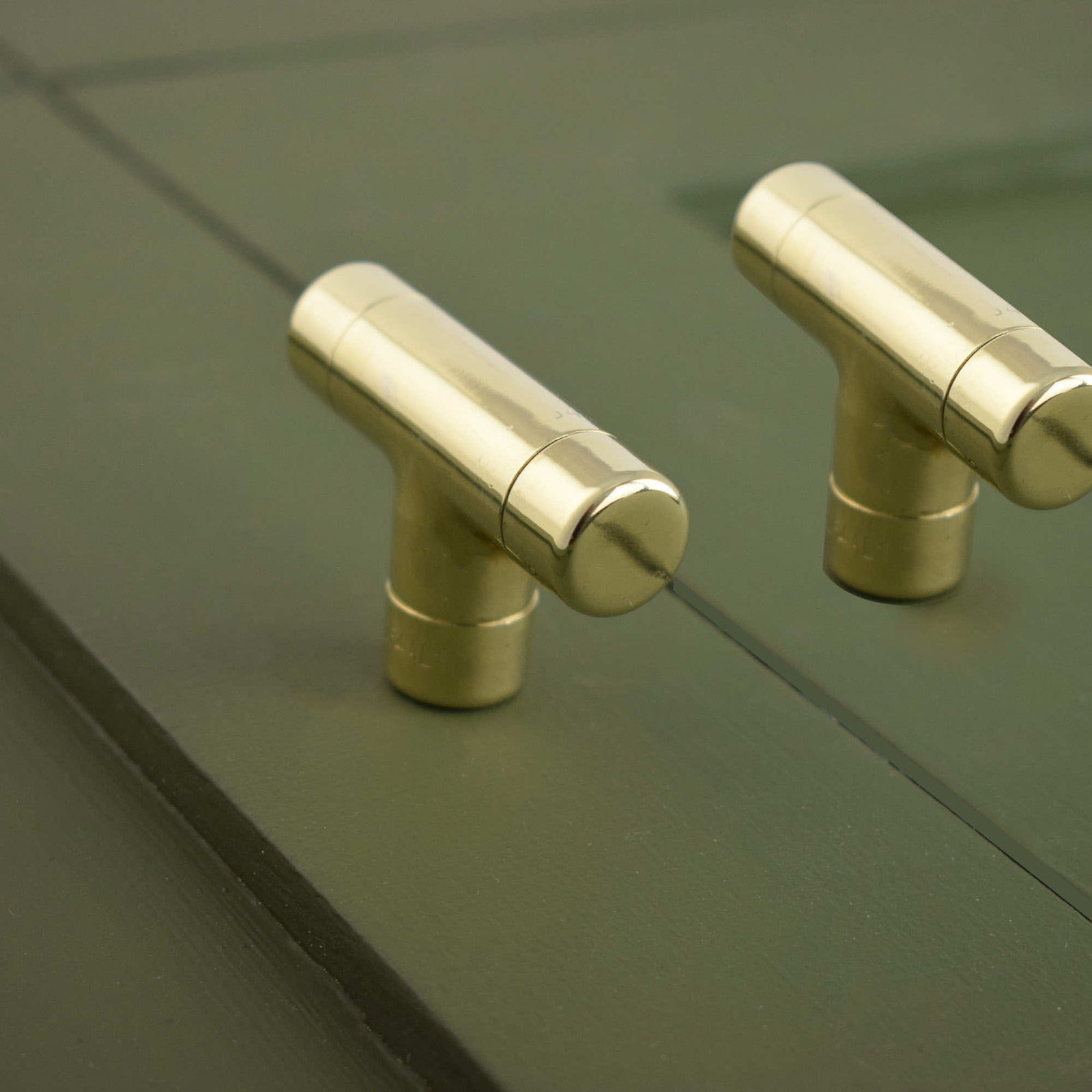 Brass T Knob On Green Drawers