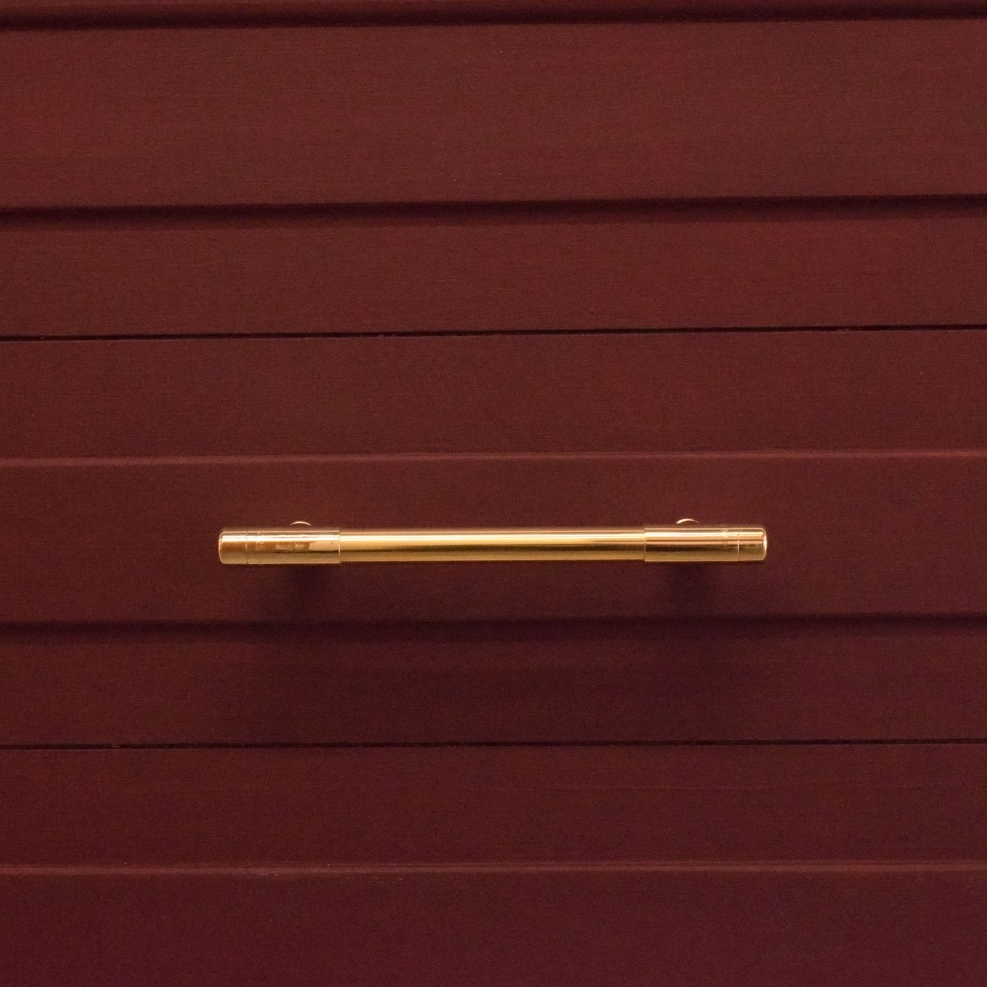 Satin High Polish Brass T-Shaped Pull Handle on red drawers