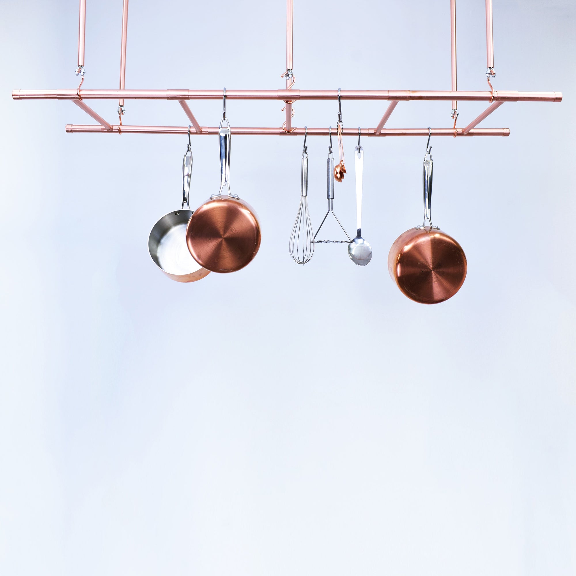 Copper Ceiling Pot and Pan Ladder Rack - Against white backdrop