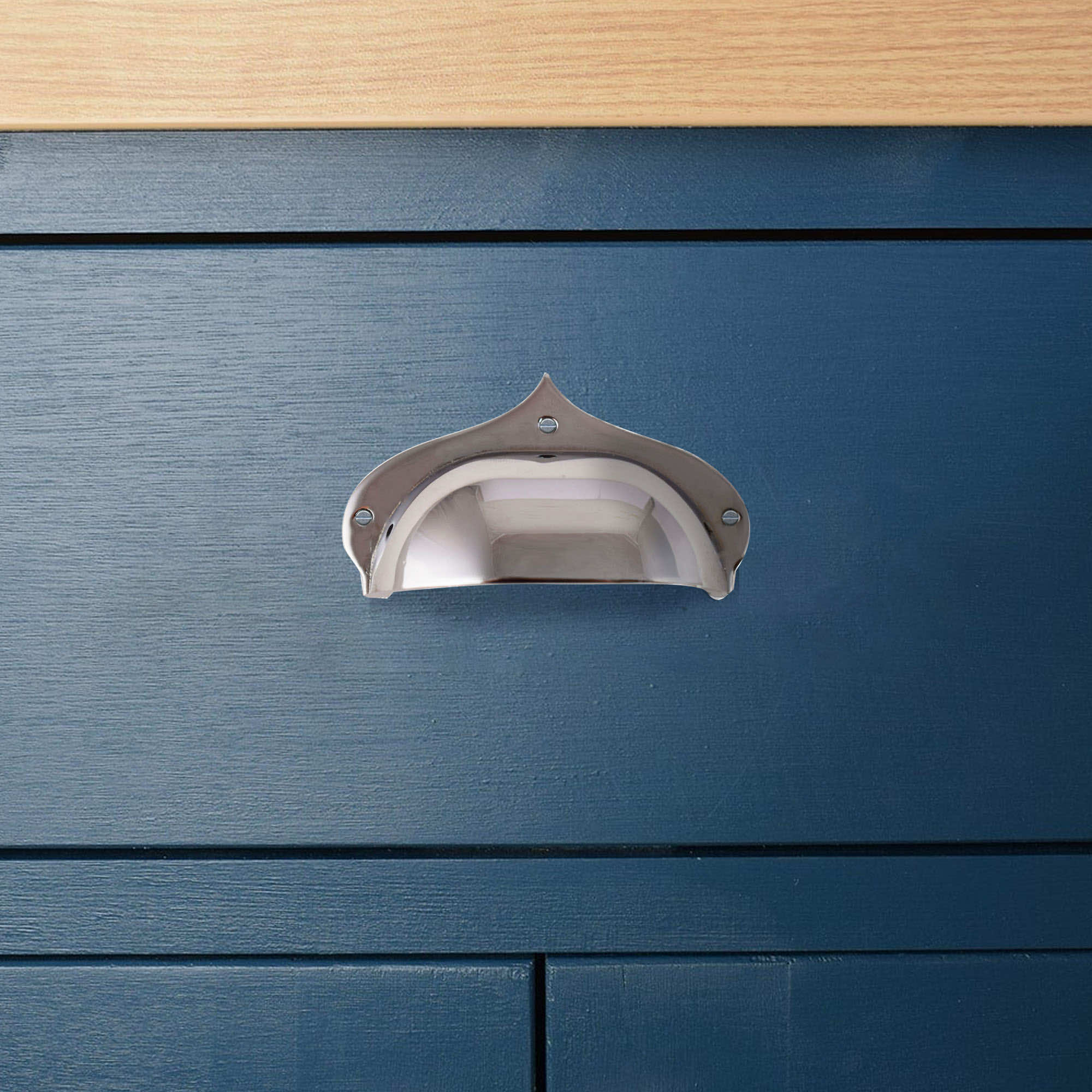 chrome pavilion cup handle on blue kitchen drawers