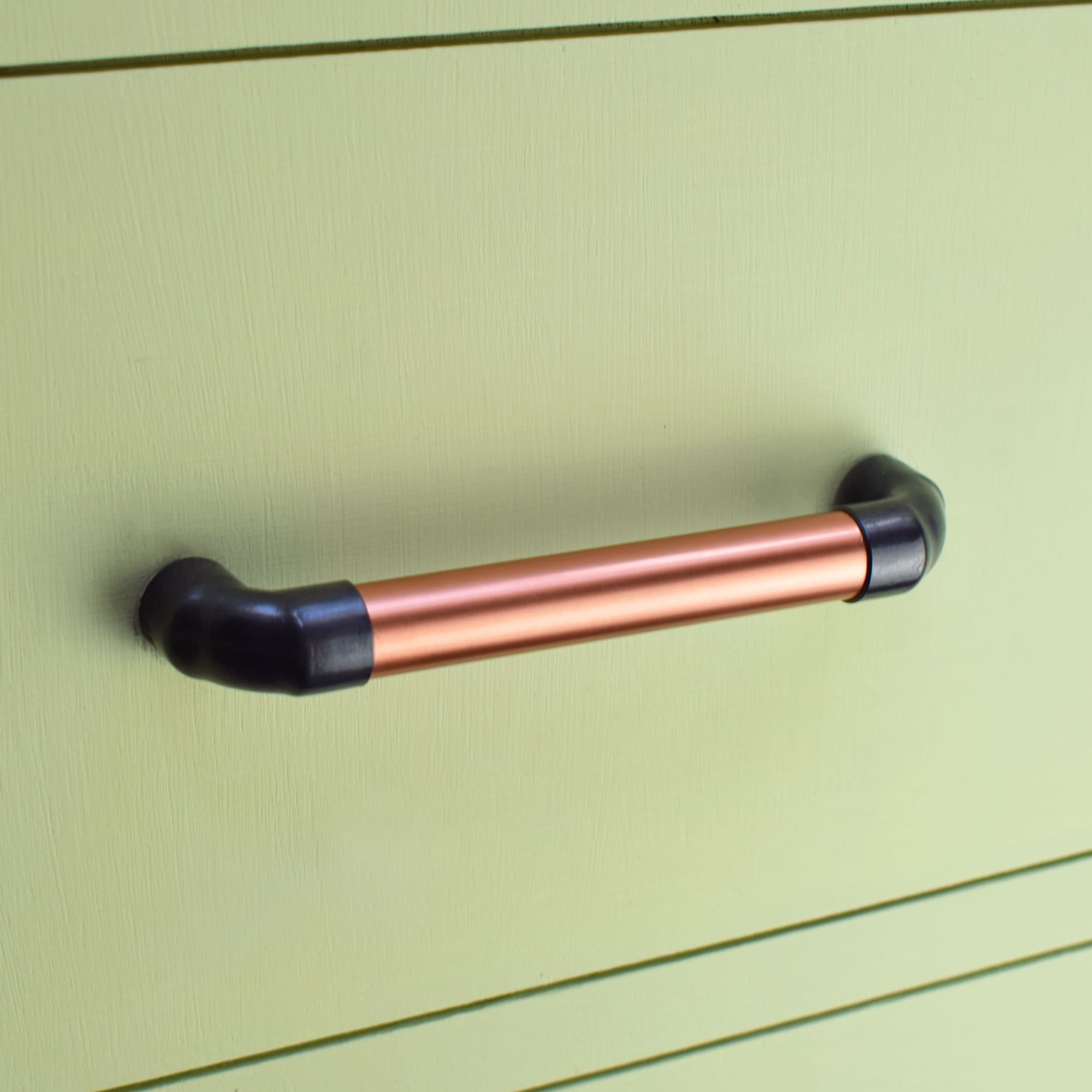 Matt Black Handle - Satin Copper Mix - On green kitchen drawers