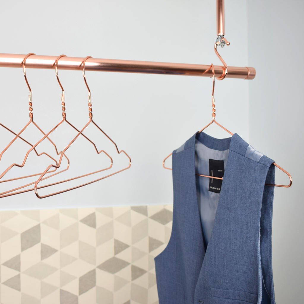 Copper clothes hanger with blue jacket