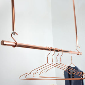 Copper Clothes Hangers on copper hanging rail