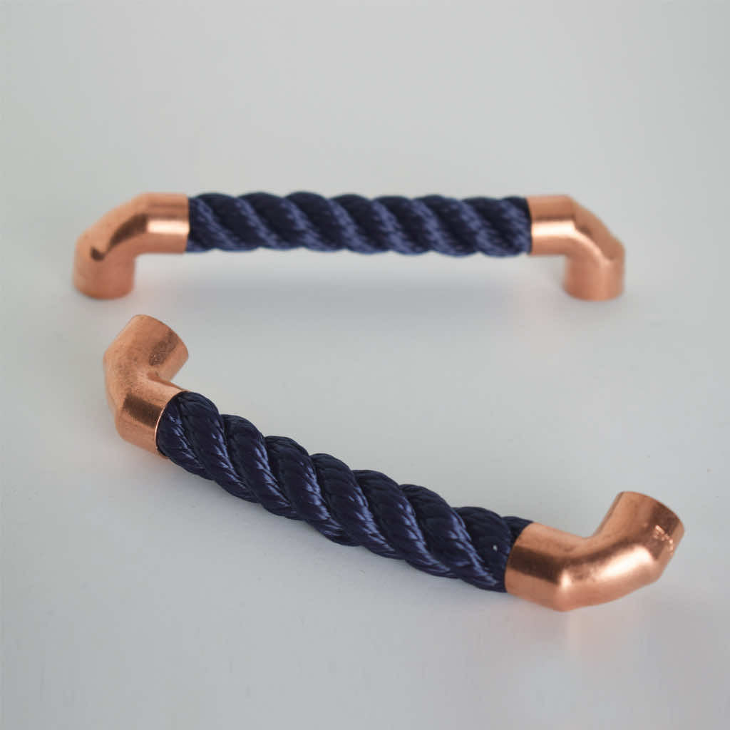 Two copper and navy rope pull handles