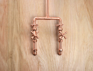 copper taps and faucets mounted on a therapeutic shower