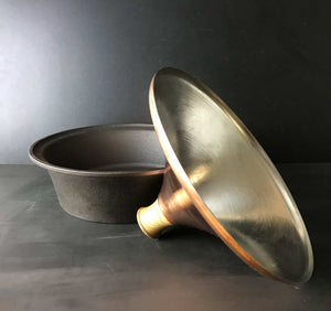Copper Tagine Bowl with lid on table