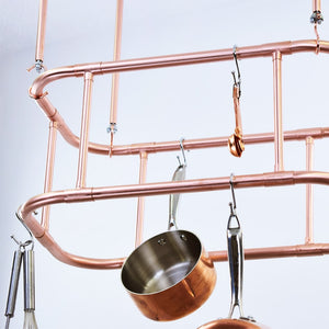 Two Tier Curved Copper Hanging Pot and Pan Rack closeup of hanging items