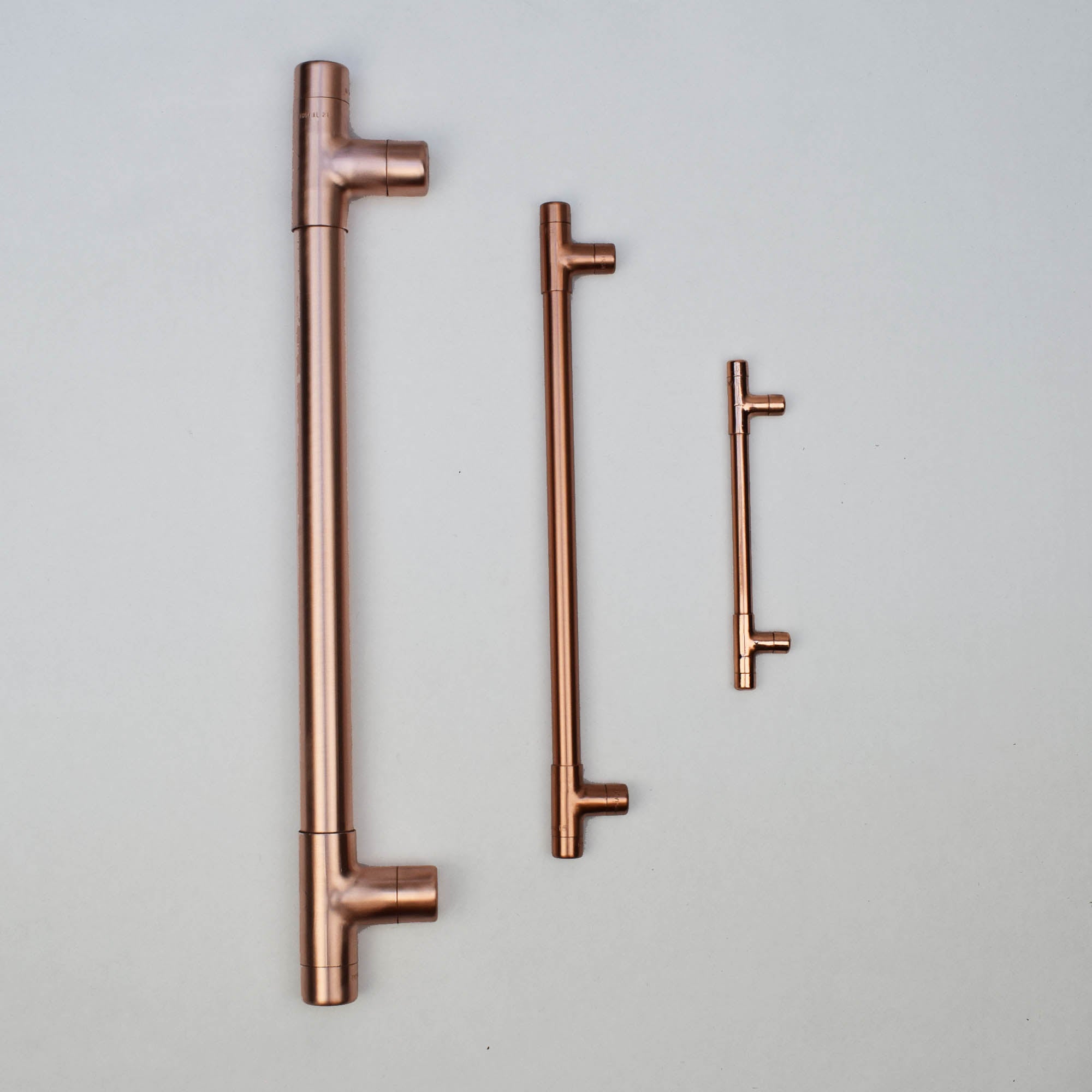 A comparison of our copper t pulls and front door large handle