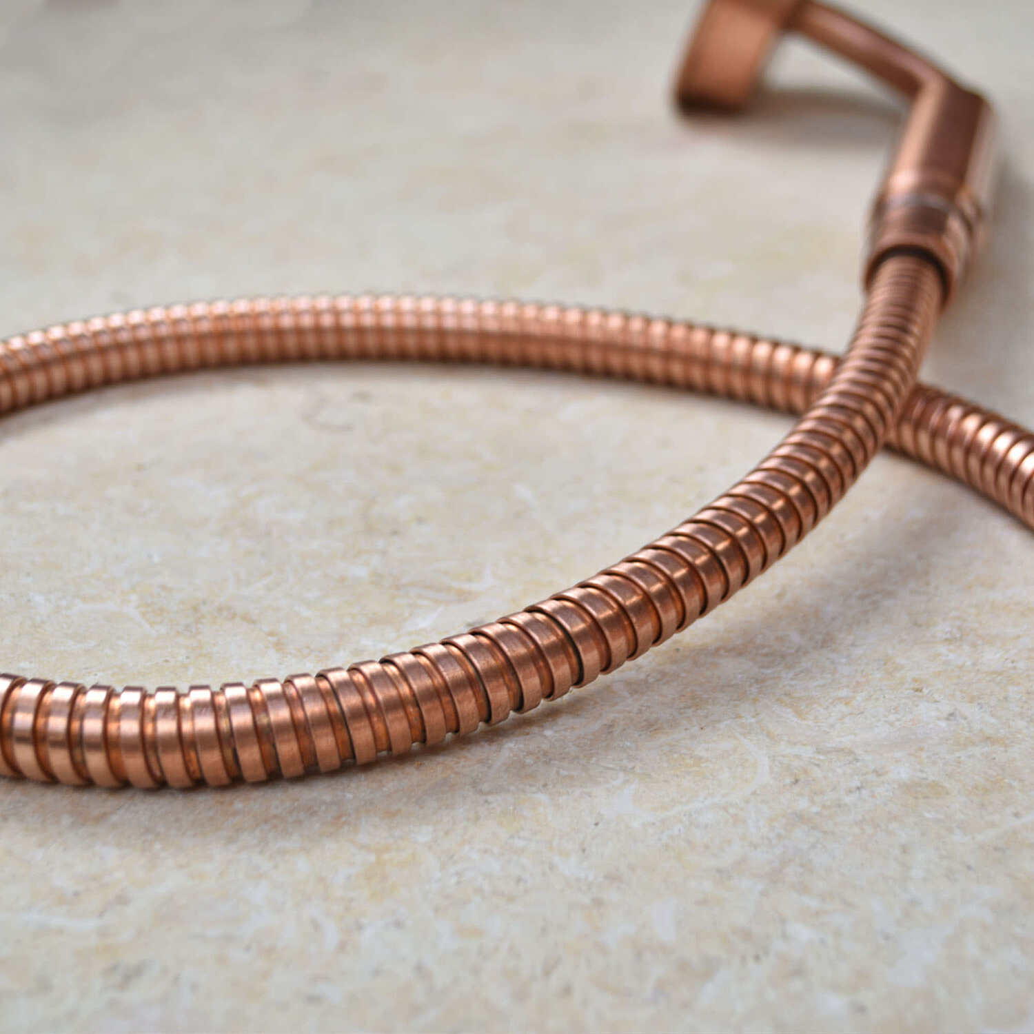 Copper hand-shower and copper flexible hose - shower accessories available at Proper Copper Design