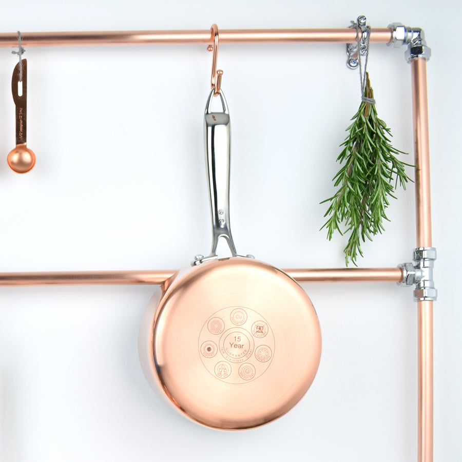 Copper and chrome kitchen storage closeup