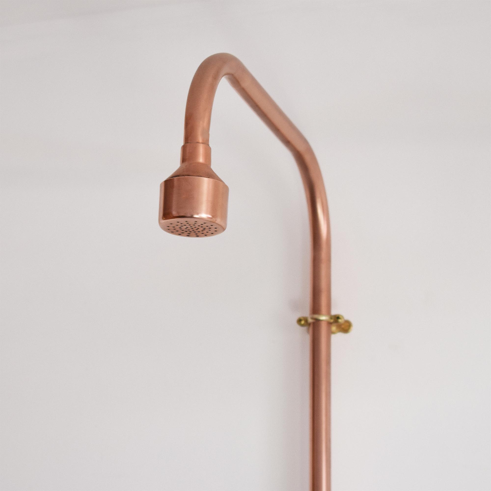 handmade copper shower head for a massaging outdoor showering experience 