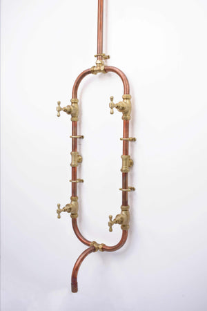 brass taps featured on a shower faucet rustic copper finish