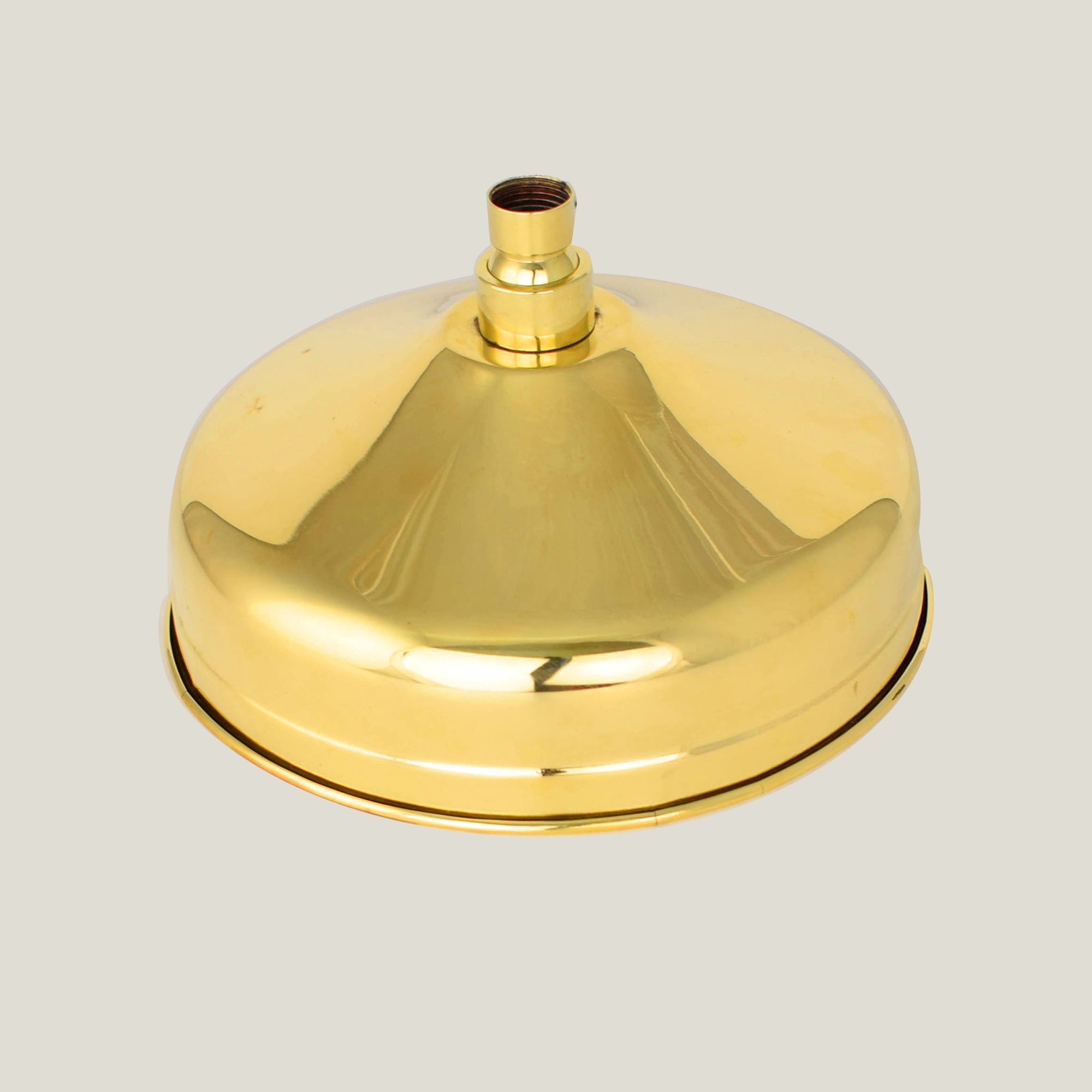 A minimalist brass shower head with a simple and sleek round design, providing a powerful rainfall spray pattern - Made in England