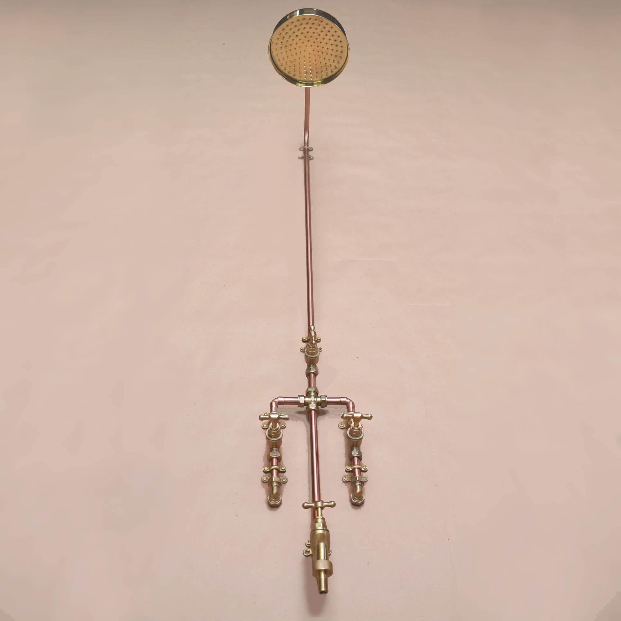 Underside photo of the copper and brass garden shower with tap attachment and hose connection