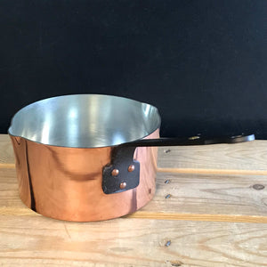 copper pot and pan on table