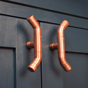 Curved Copper Handle on Blue Cabinet Side Angle