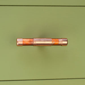 Copper Knob T-shaped - Marbled and High Polish Mix - On Green Background