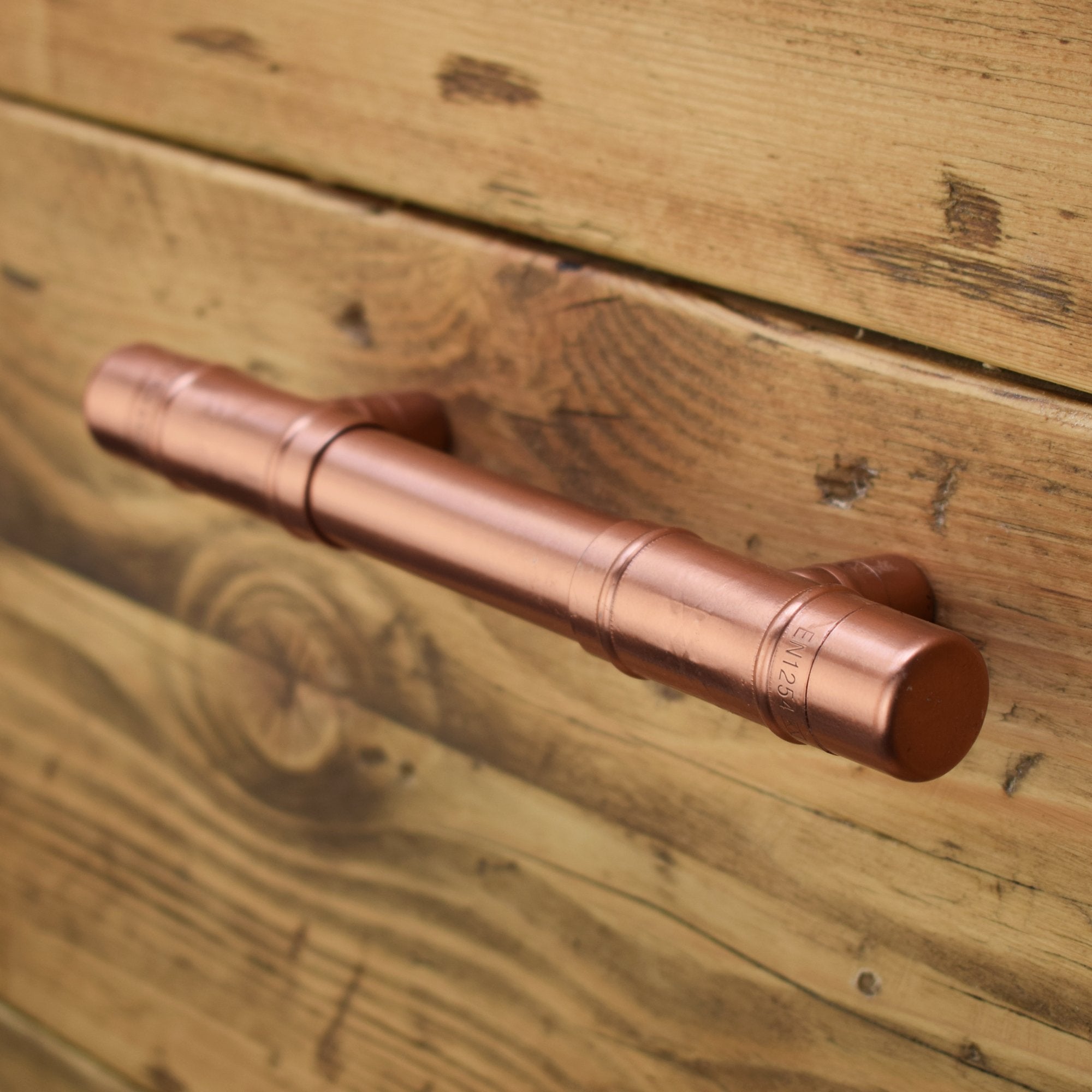 Copper T-Barn Door Pull on Wood Drawers Angled