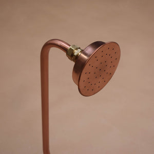 Close up photo of a copper shower head by Proper Copper Design