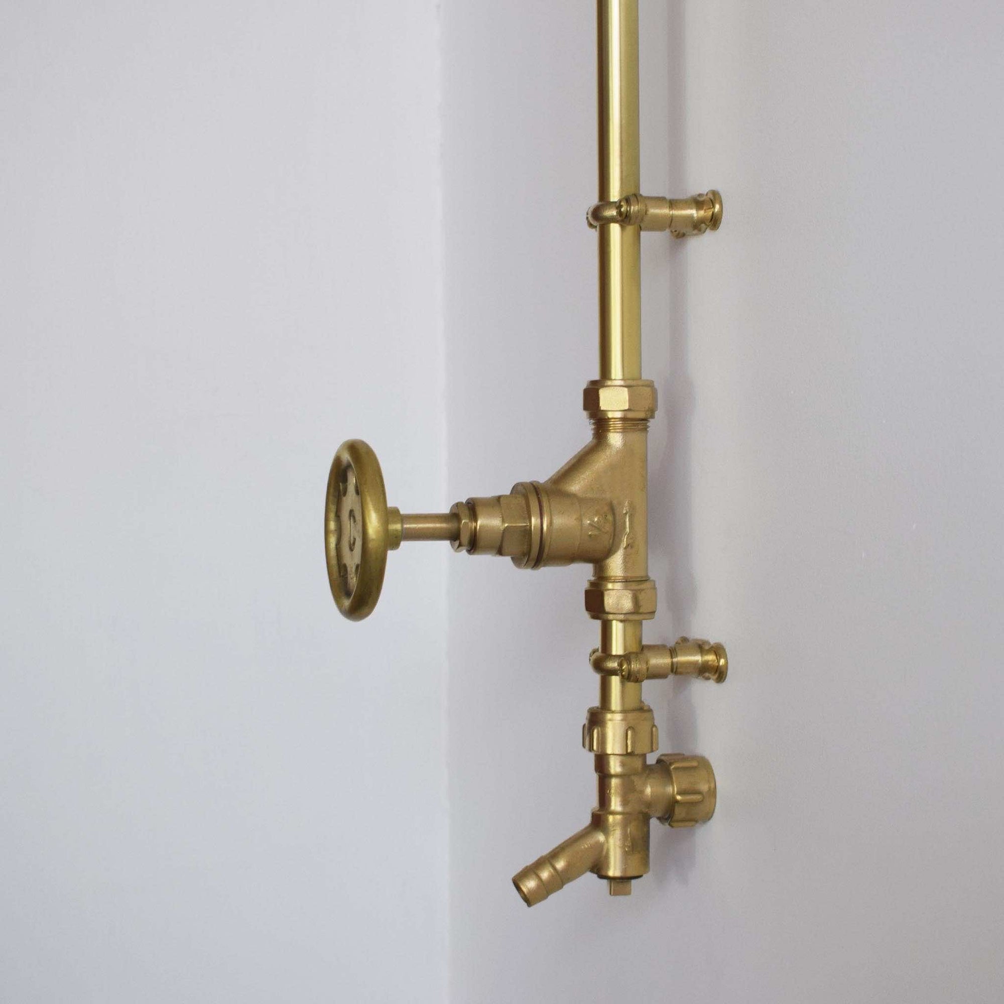 brass outdoor showers in our Brighton bathroom showroom