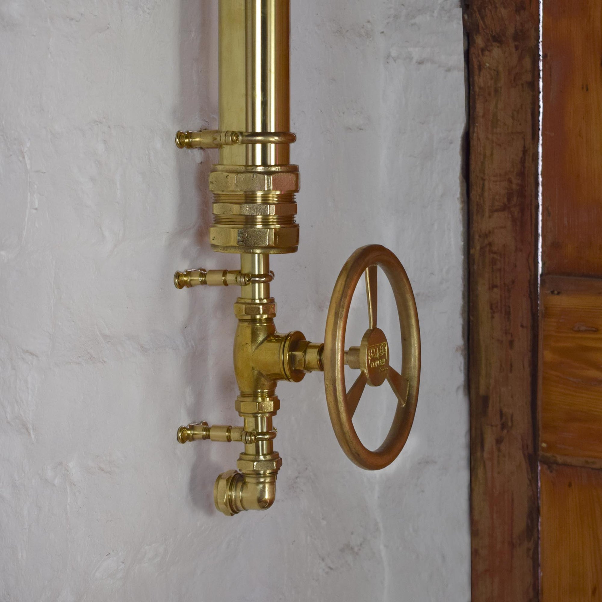 exposed brass shower in our Brighton bathroom shop