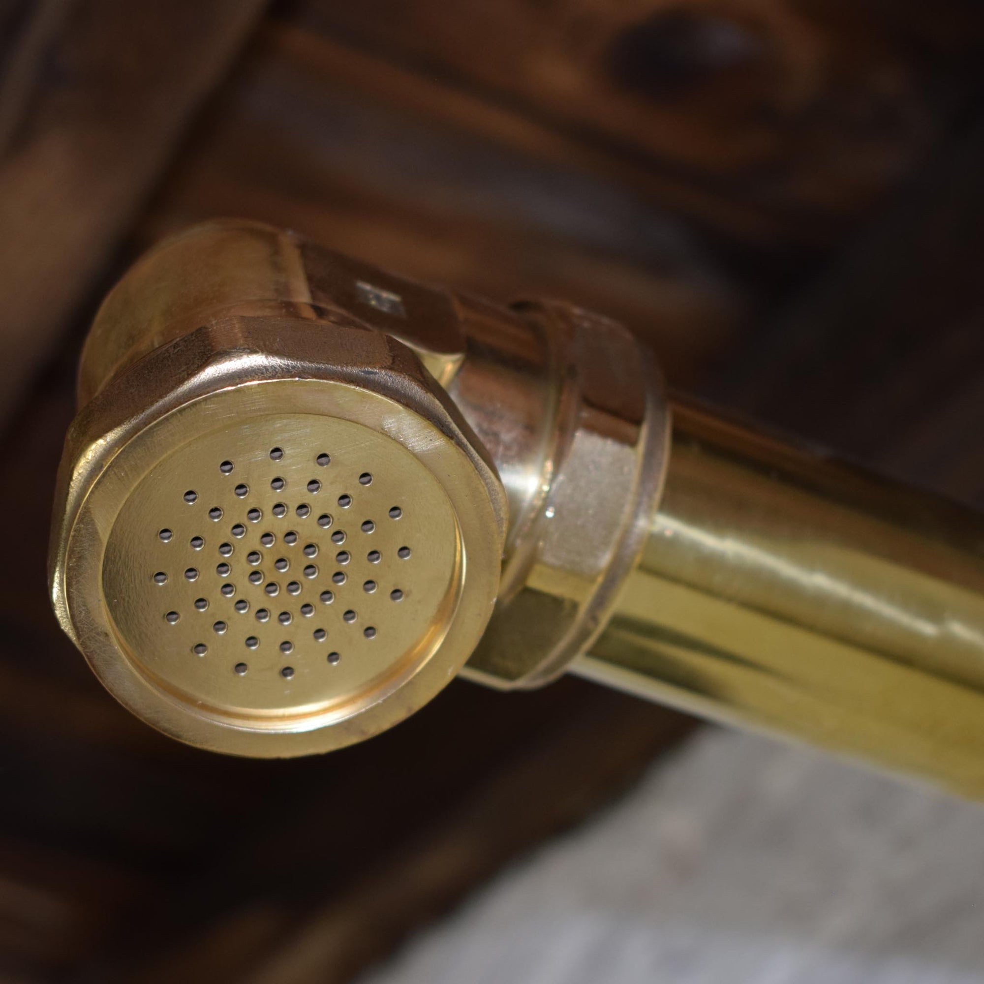brass shower head close up image made in Britain